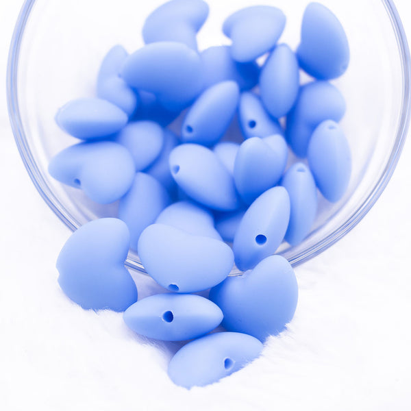 Top view of a pile of 20mm Blue heart silicone bead