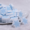 front view of a pile of Blue Snowflake Silicone Focal Bead Accessory - 28mm x 28mm