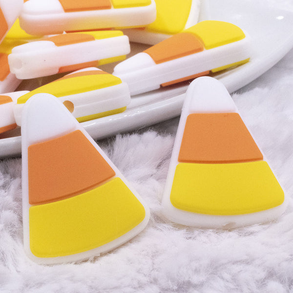 Close up view of a Candy Corn Silicone Focal Bead Accessory - 29mm x 21mm