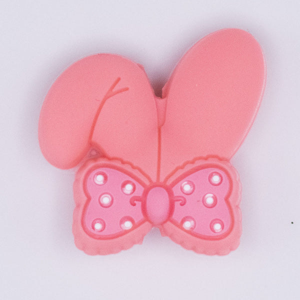 close up view of Coral Bunny Ears Silicone Focal Bead Accessory - 26mm x 26mm