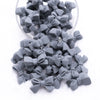 Front view of a pile of 27mm Dark Gray Bow Knot silicone bead