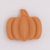 Close up view of a Fall Orange Pumpkin Silicone Focal Bead Accessory - 27mm x 30mm