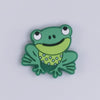 top view of a pile of Green Frog Silicone Focal Bead Accessory - 30mm x 33mm