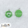 Top picture of a pile of Green 16mm Candy M & M Resin charms