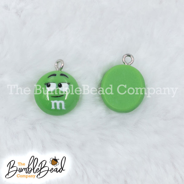 Top picture of a pile of Green 16mm Candy M & M Resin charms