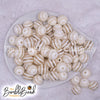 top view of a pile of 16mm Cream Striped Bubblegum Beads