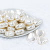 Front view of a pile of 27mm Ivory Pearl Heart Acrylic Bubblegum Beads