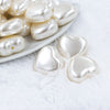 Micro view of a pile of 27mm Ivory Pearl Heart Acrylic Bubblegum Beads
