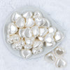 Top view of a pile of 27mm Ivory Pearl Heart Acrylic Bubblegum Beads