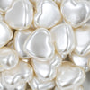 Close up view of a pile of 27mm Ivory Pearl Heart Acrylic Bubblegum Beads