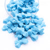 Front view of a pile of 27mm Blue Butterfly Bow Knot silicone bead