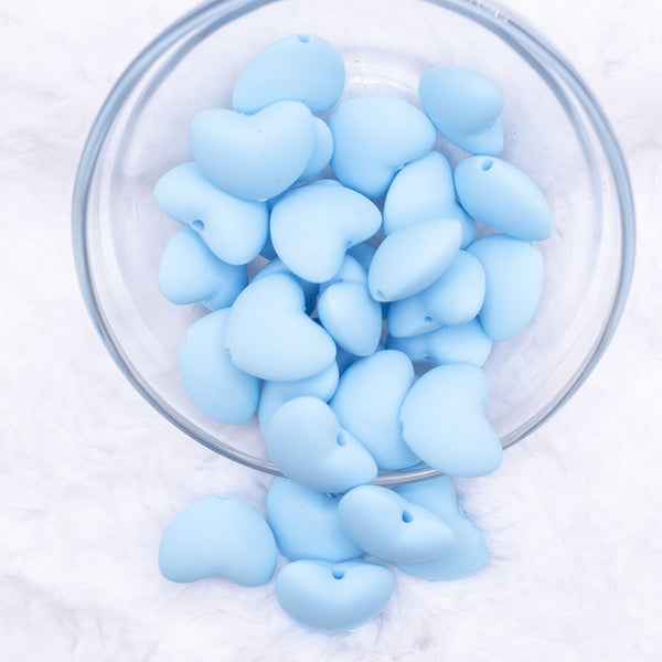 Top view of a pile of 20mm Light Blue heart silicone bead