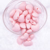Front view of a pile of 20mm Light Pink heart silicone bead