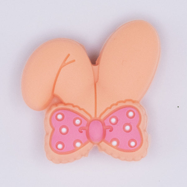 close up view of Orange Bunny Ears Silicone Focal Bead Accessory - 26mm x 26mm