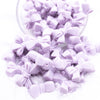 Front view of a pile of 27mm Periwinkle Purple Bow Knot silicone bead