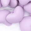 Close up view of a pile of 20mm Periwinkle Purple heart silicone bead