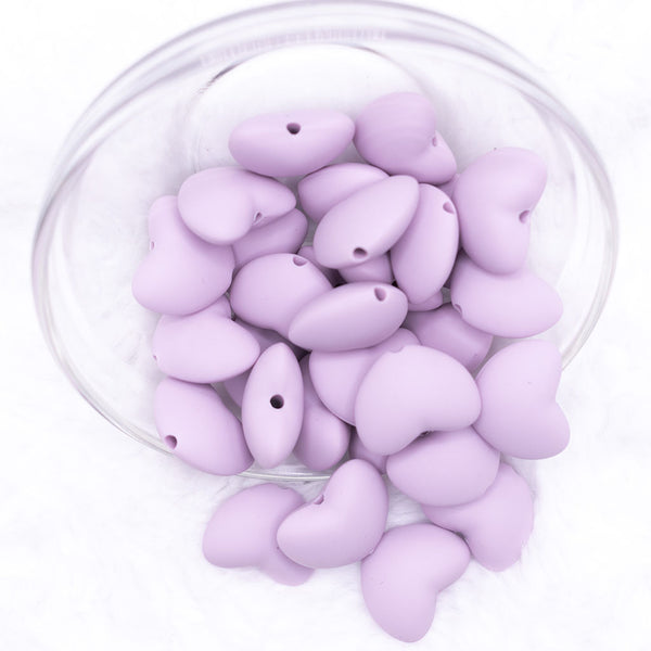 Top view of a pile of 20mm Periwinkle Purple heart silicone bead