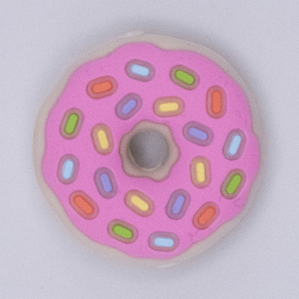 top view of a pile of Donut with Pink Icing and Sprinkles Silicone Focal Bead Accessory - 28mm