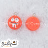 Top picture of a pile of Orange 16mm Candy M & M Resin charms