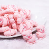 front view of a pile of Pink Pig Silicone Focal Bead Accessory
