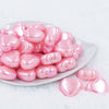 Front view of a pile of 27mm Pink Pearl Heart Acrylic Bubblegum Beads