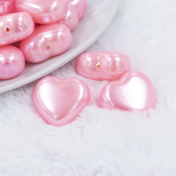 Micro view of a pile of 27mm Pink Pearl Heart Acrylic Bubblegum Beads