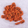 top view of a pile of Pumpkin Silicone Focal Bead Accessory - 30mm x 27mm