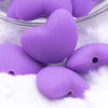 Close up view of a pile of 20mm Purple heart silicone bead