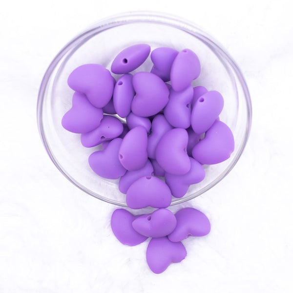 Top view of a pile of 20mm Purple heart silicone bead
