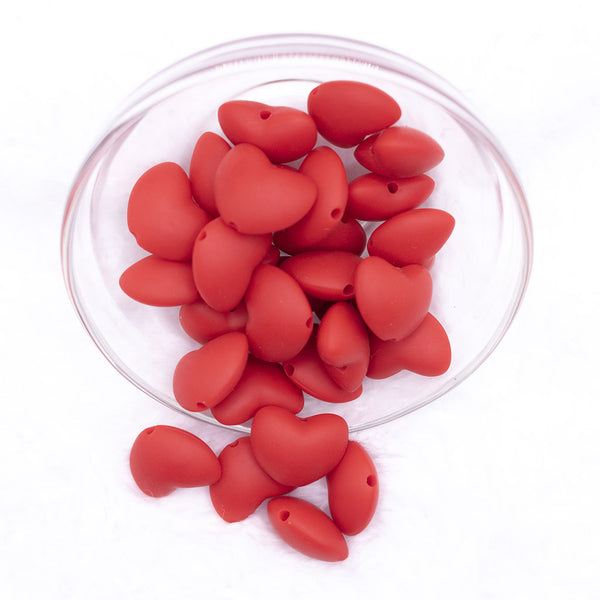 Top view of a pile of 20mm Red heart silicone bead