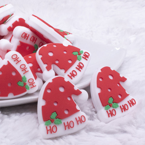 front view of a pile of Ho Ho Ho Santa Hat Silicone Focal Bead Accessory