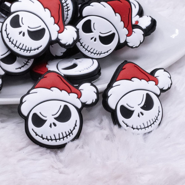 front view of a pile of Santa Skeleton Silicone Focal Bead Accessory - 31mm x 30mm