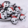 close up view of a pile of Santa Skeleton Silicone Focal Bead Accessory - 31mm x 30mm