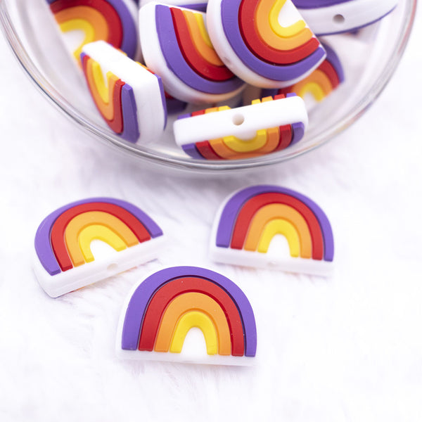 Top view of a pile of 25mm Rainbow silicone focal bead