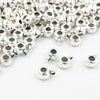Close up view of a pile of Silver Spacer with Charm Mount - Set of 10