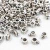 Close up view of a pile of Silver Drum Spacer with Charm Mount - Set of 10