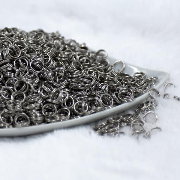 front view of a pile of 8mm Platinum Iron Split Rings for Jewelry Making