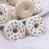 macro view of a pile of Donut with White Icing and Sprinkles Silicone Focal Bead Accessory - 28mm