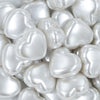 Close up view of a pile of 27mm White Pearl Heart Acrylic Bubblegum Beads