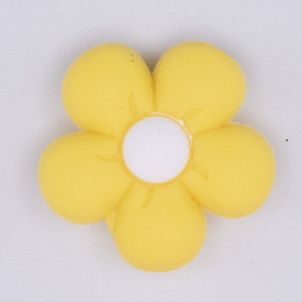 close up view of a Yellow Flower Silicone Focal Bead Accessory - 26mm x 26mm