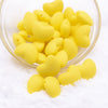 Top view of a pile of 20mm Yellow heart silicone bead