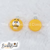 Top picture of a pile of Yellow 16mm Candy M & M Resin charms