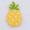 top view of a pile of Pineapple Silicone Focal Bead Accessory - 19mm x 32mm