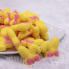 front view of Yellow Bunny Ears Silicone Focal Bead Accessory - 26mm x 26mm